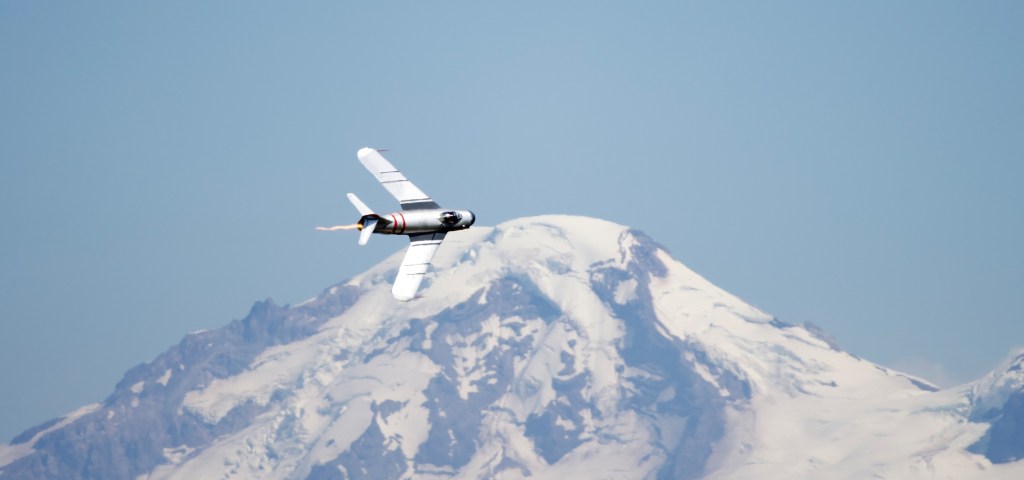 The Mig-17F Fresco in flight at the Abbotsford Air Show 2026 with Mount Baker as a backdrop.